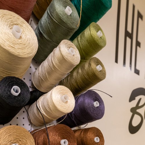 Thread spools used for rug design at Bockrath Rug Studio