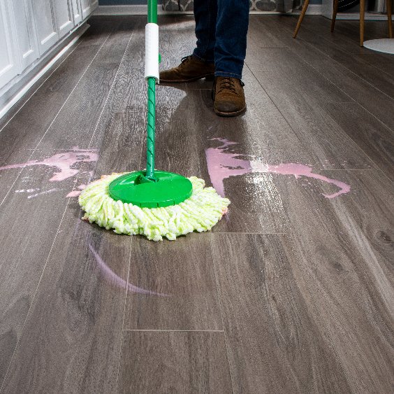 Mopping pink liquid on a waterproof vinyl floor