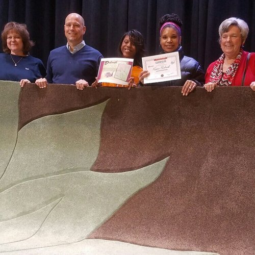 Custom area rug contest winner with Bockrath Flooring team
