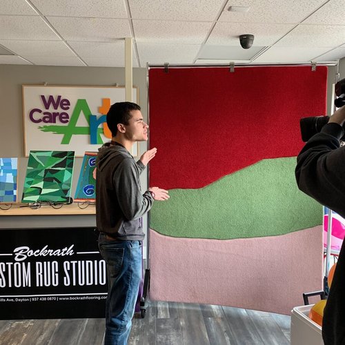 Filming a colorful rug in Dayton OH by Bockrath Flooring & Rugs