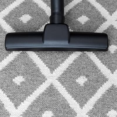 Vacuum on a patterned carpet in Dayton OH by Bockrath Rug Studio